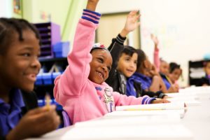 Aspire Memphis Students raising their hands