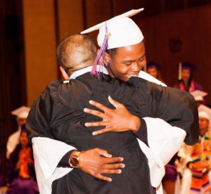 Aspire student hugging teacher at graduation
