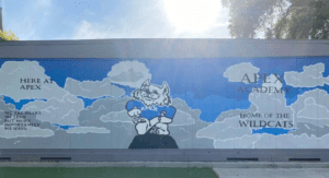 Aspire APEX Academy's school mural highlighting its mantra and mascot.