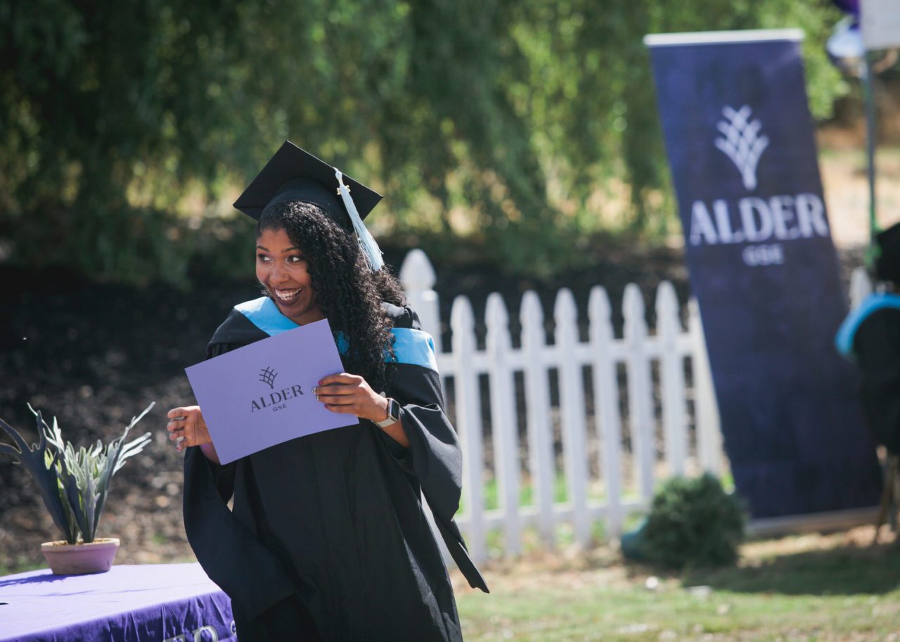 Alder grad excitedly accepts diploma
