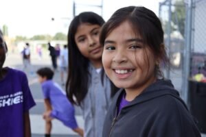 Aspire Inskeep scholars smile at the camera during recess.