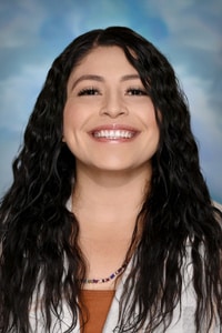 Headshot of Daisy Rivera against a blue background